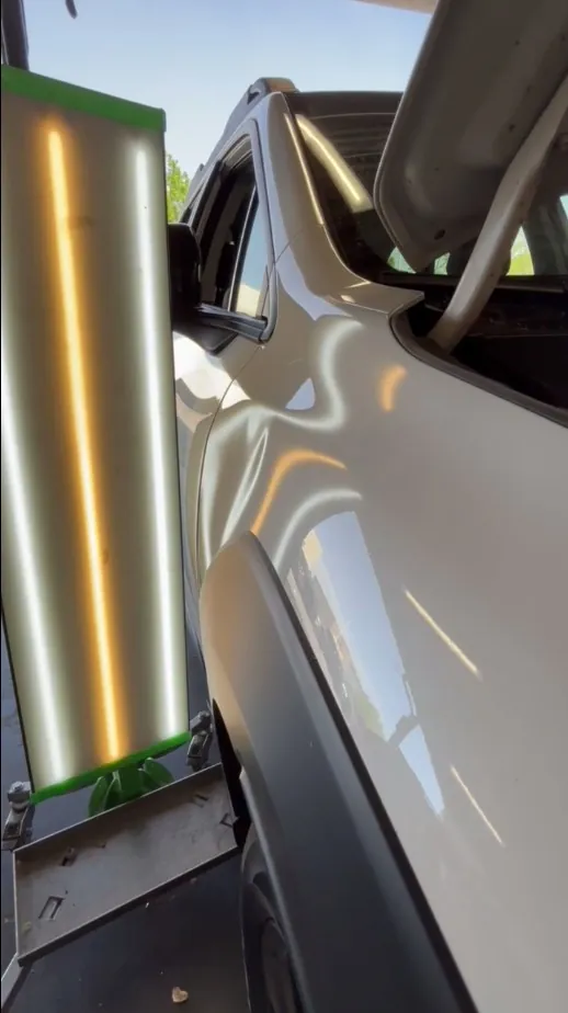 Large dent revealed under the reflection board